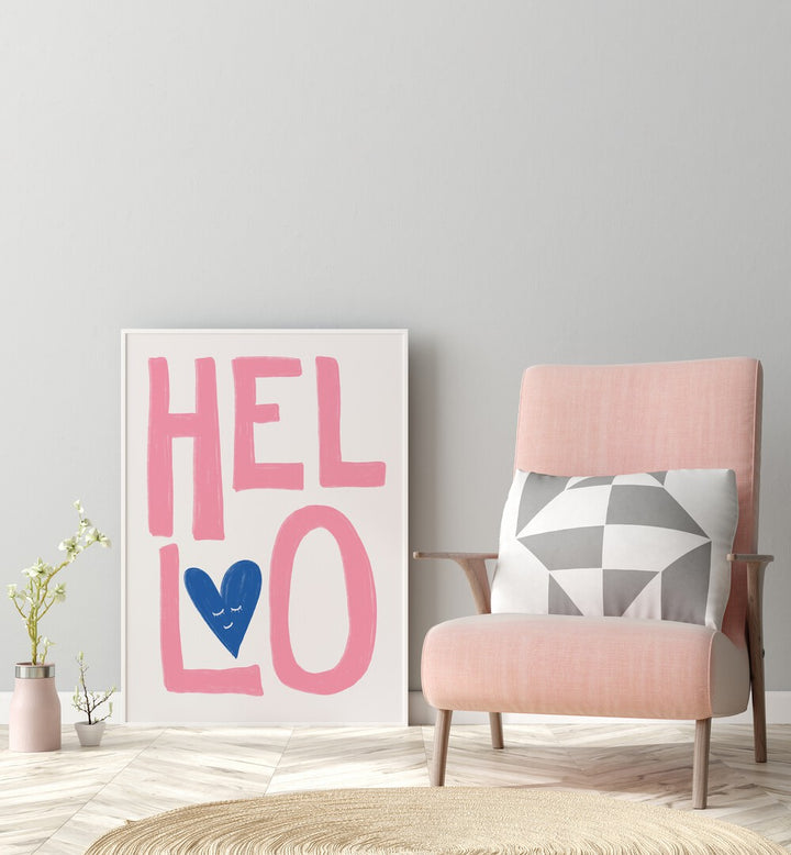 Hello by Athene Fritsch Quotes Posters Wall Art Prints in White Plain Frame placed on the floor beside a chair