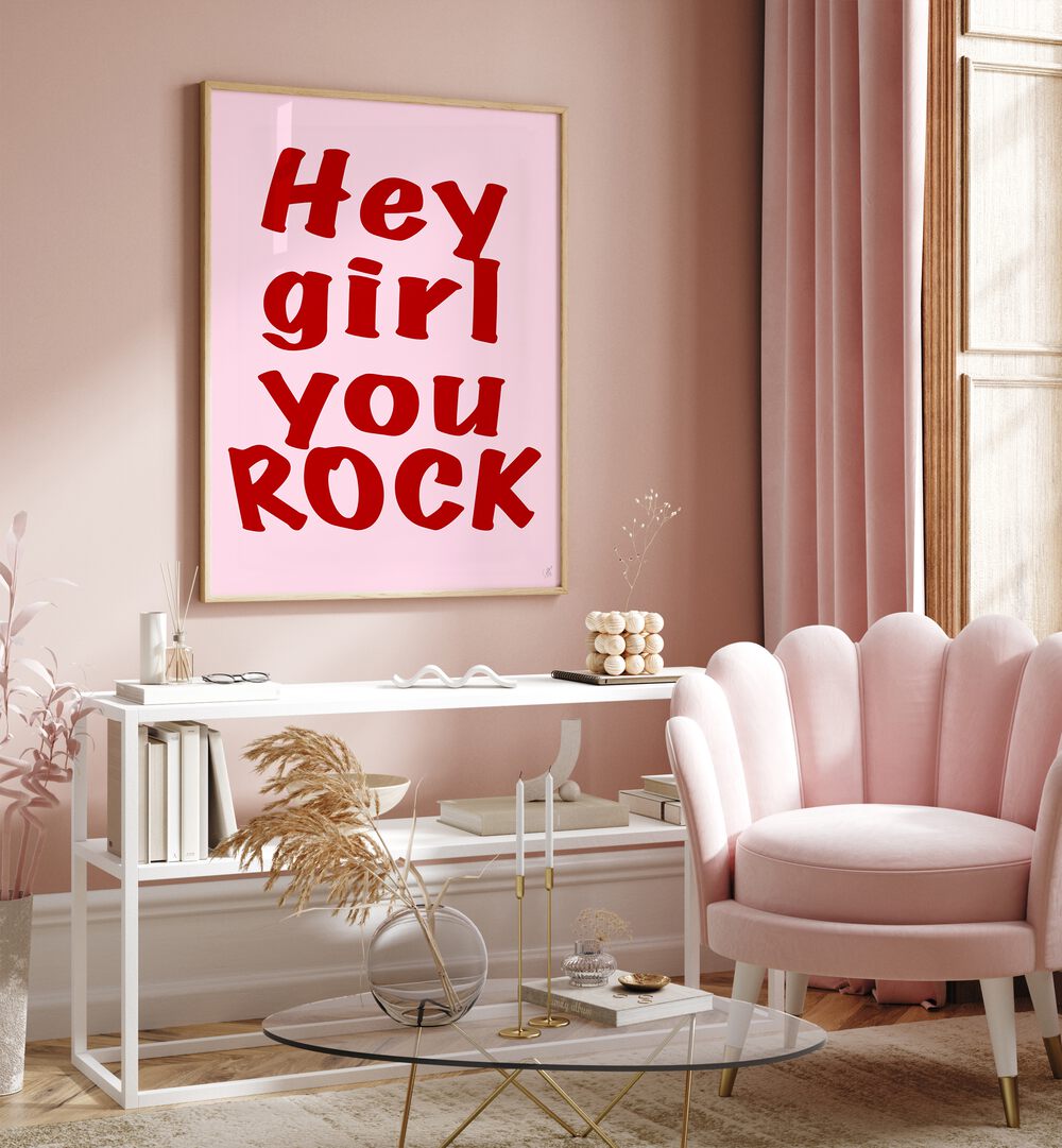 Hey Girl You Rock by Anne-marie Volfova Quotes and Typography Posters in Oak Wood Plain Frame placed on a wall behind a table and beside a window