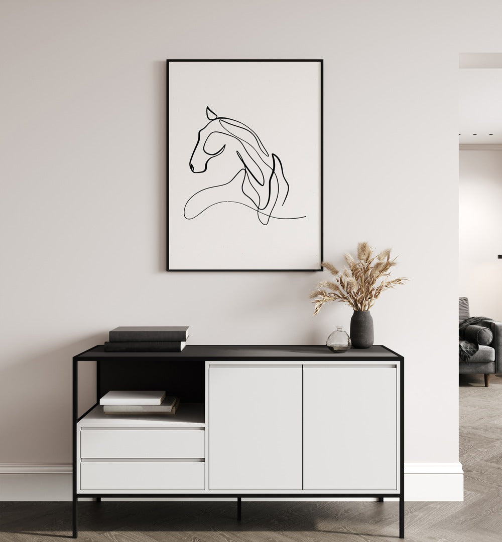 Horse At Rest Line Art Painting in Black Plain Frame placed on a Cream Colored Wall above a Console Table in the Drawing Room