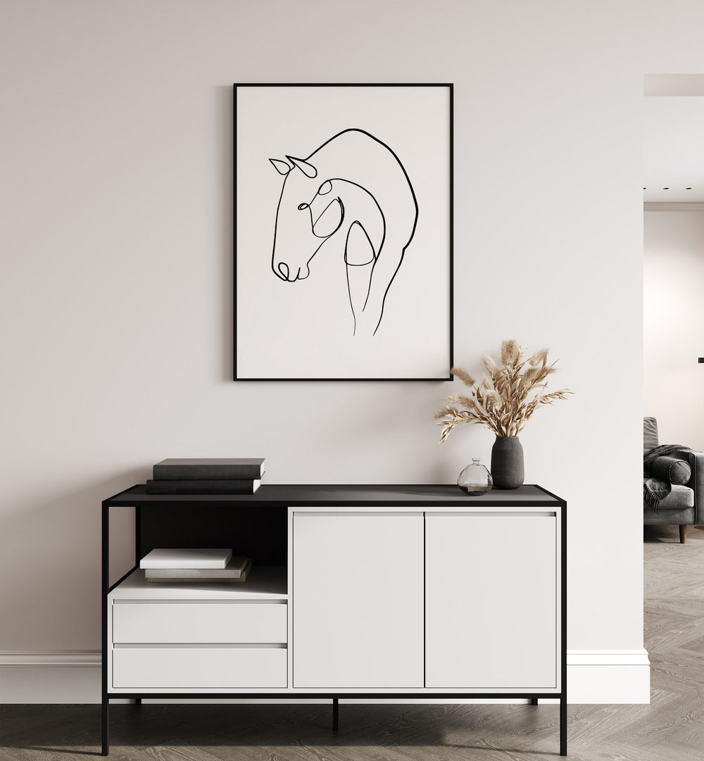 Horse Stable Line Art Painting in Black Plain Frame placed on a Cream Colored Wall above a Console Table in the Drawing Room