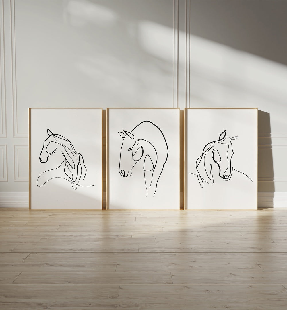 Horses Line Art Set Set Of 3 Paintings in White Plain Frame placed on the floor