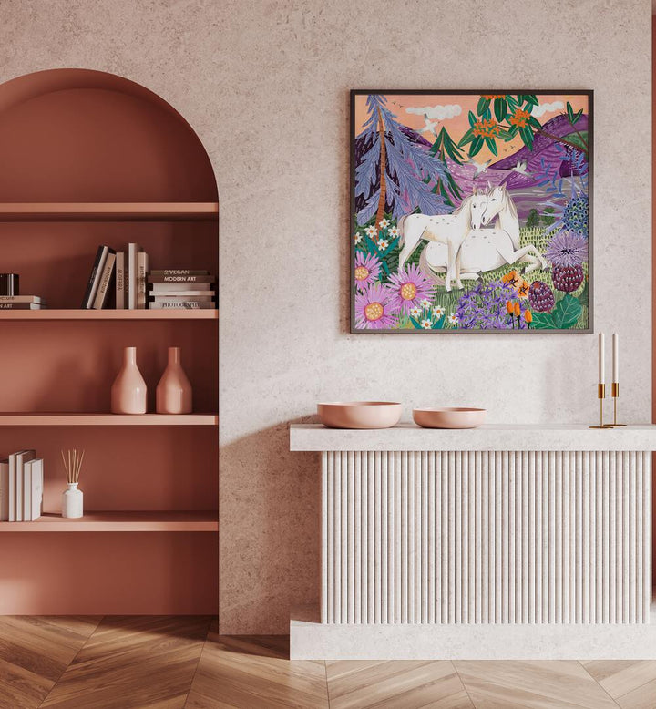 Horses in the Mountains By Caroline Bonne Muller Wildlife Paintings in Black Plain Frame on a pink wall above a table