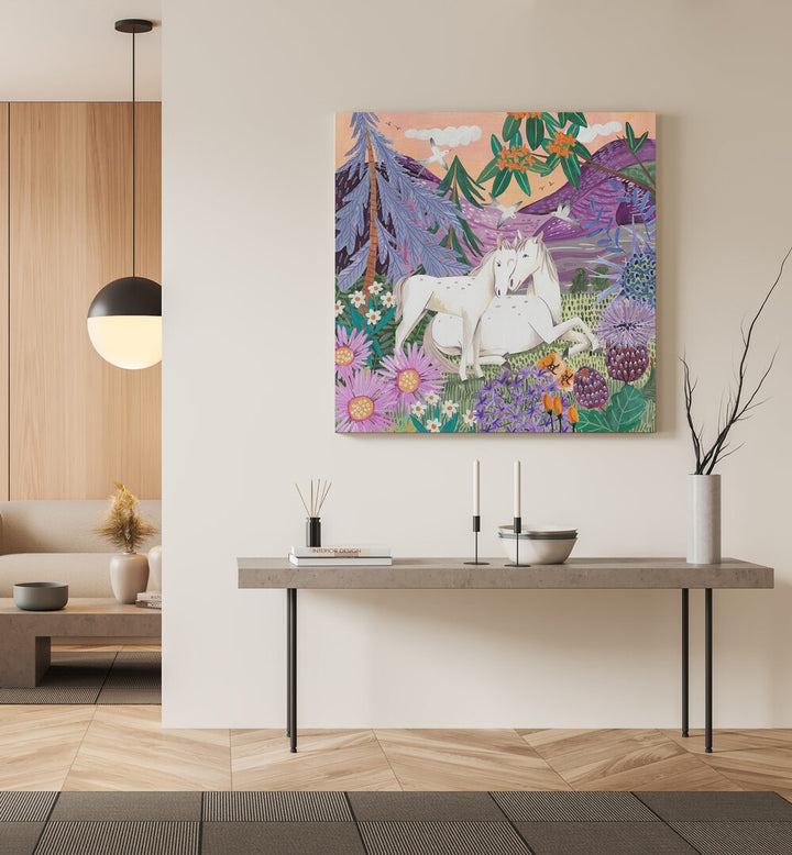 Horses in the Mountains By Caroline Bonne Muller Wildlife Paintings in Gallery Wrap on a cream wall above a table