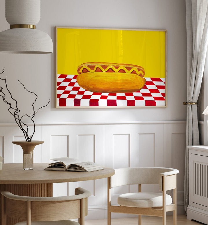 Hot Dog With Mustard Red Check Yellow by Alice Straker Cafe Art Prints Cafe Posters in Oak Wood Plain Frame placed on a wall in a dining room area beside a window and behind a dining table