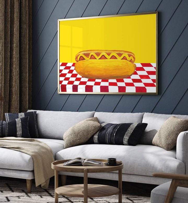 Hot Dog With Mustard Red Check Yellow by Alice Straker Cafe Art Prints Cafe Posters in Gold Plain Frame placed on a living room wall behind a sofa