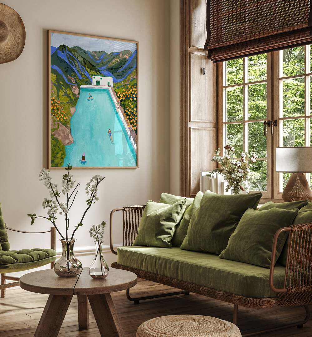 Hotsprings By Sarah Gesek Wall Art Prints in Oak Wood Plain Frame placed on a living room wall beside a window and a sofa