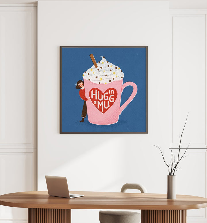 Hug In A Mug By Julia Leister Kitchen Art Prints in Black Plain Frame on a white wall placed behind a table