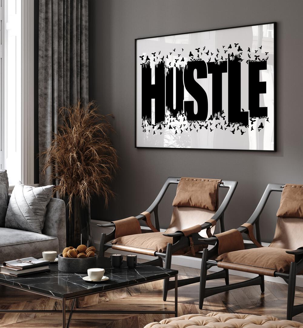 Hustle for Freedom Quotes and Typography Posters in Black Plain Frame placed in a living room wall behind chairs