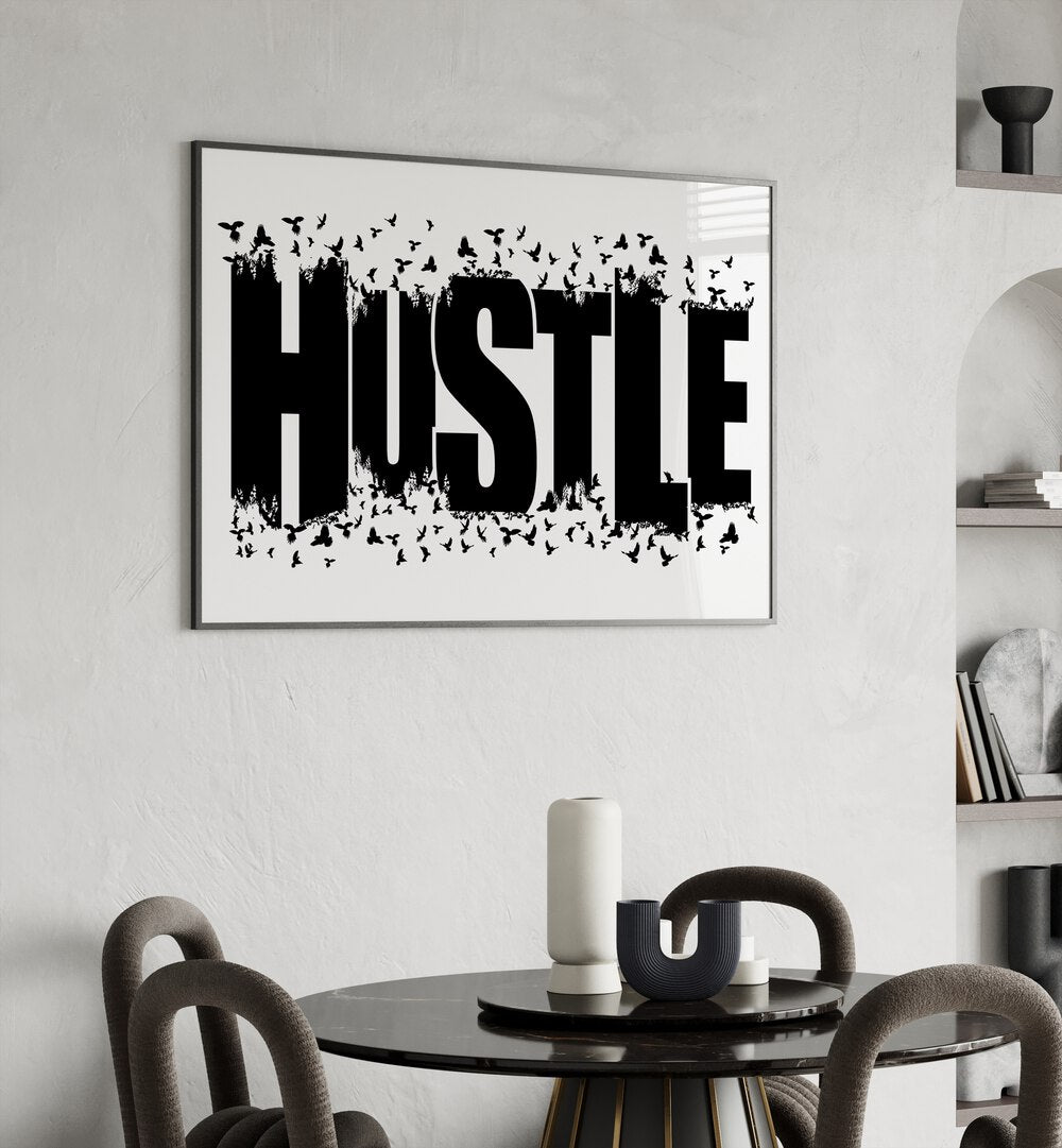 Hustle for Freedom Quotes and Typography Posters in Black Plain Frame placed on a wall behind a dining table