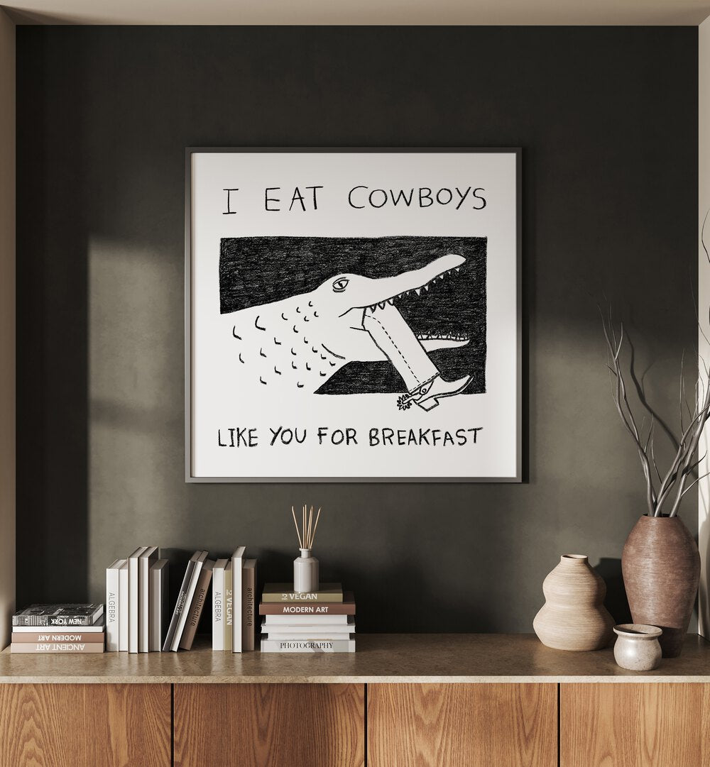 I Eat Cowboys Like You For Breakfast Quotes And Typography Posters in Oak Wood Plain Frame placed on a Dark Grey Colored Wall above a Console Table in the Drawing Room