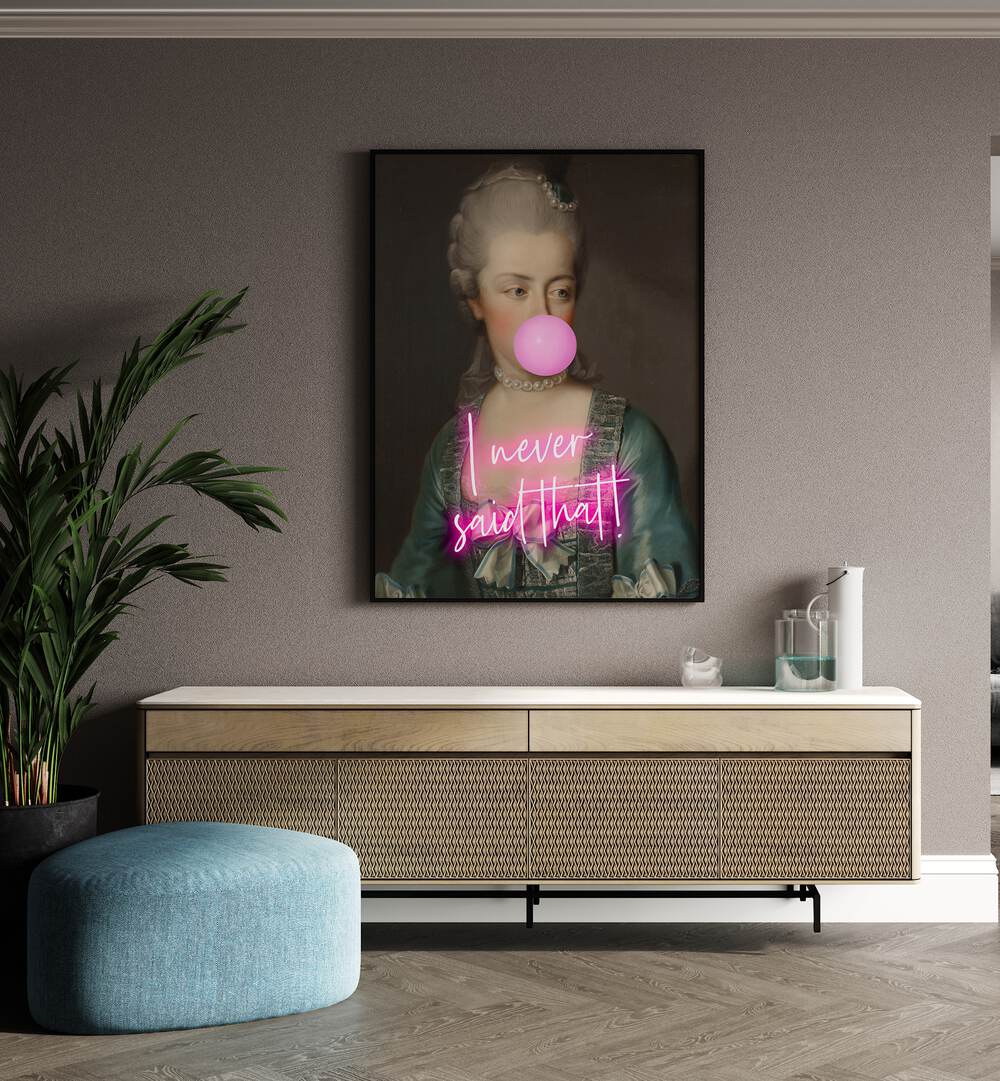 I Never Said That II By Grace Digital Art Co Altered Art Prints in Black Plain Frame placed on a wall behind a console table