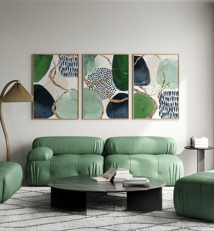 Stylish living room featuring the INDIGO GREEN GLITTER SET, SET OF 3 PAINTINGS, perfect for vibrant home decor.