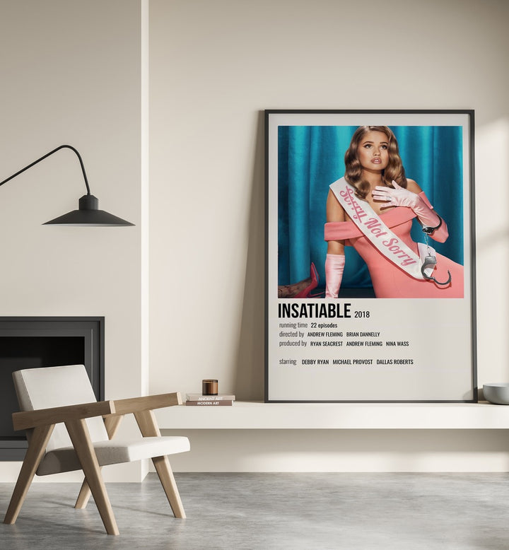 INSATIABLE 2018 MOVIE POSTERS in Black Plain Frame placed on wall beside chair and lamp