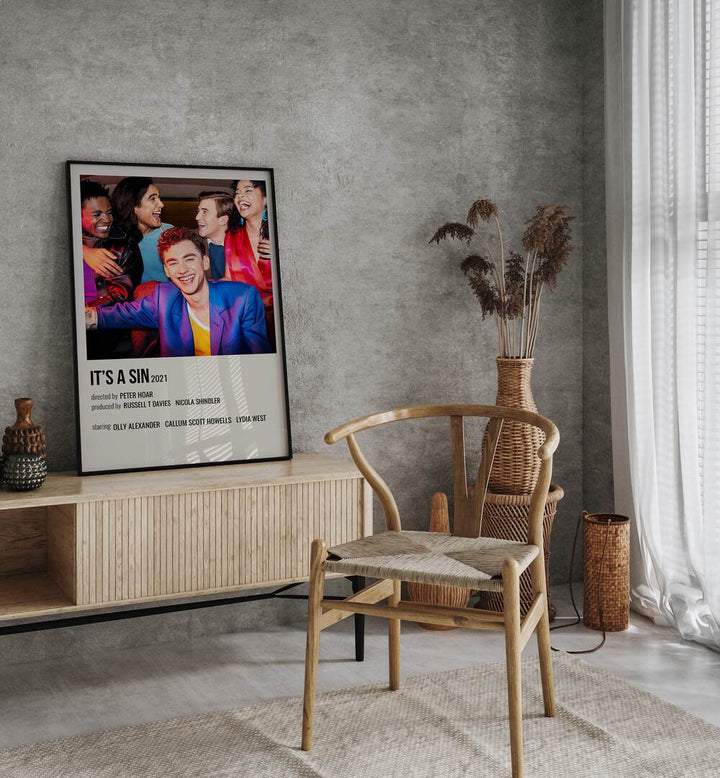 ITS A SIN 2021 MOVIE POSTERS in Black Plain Frame placed on a table beside chair