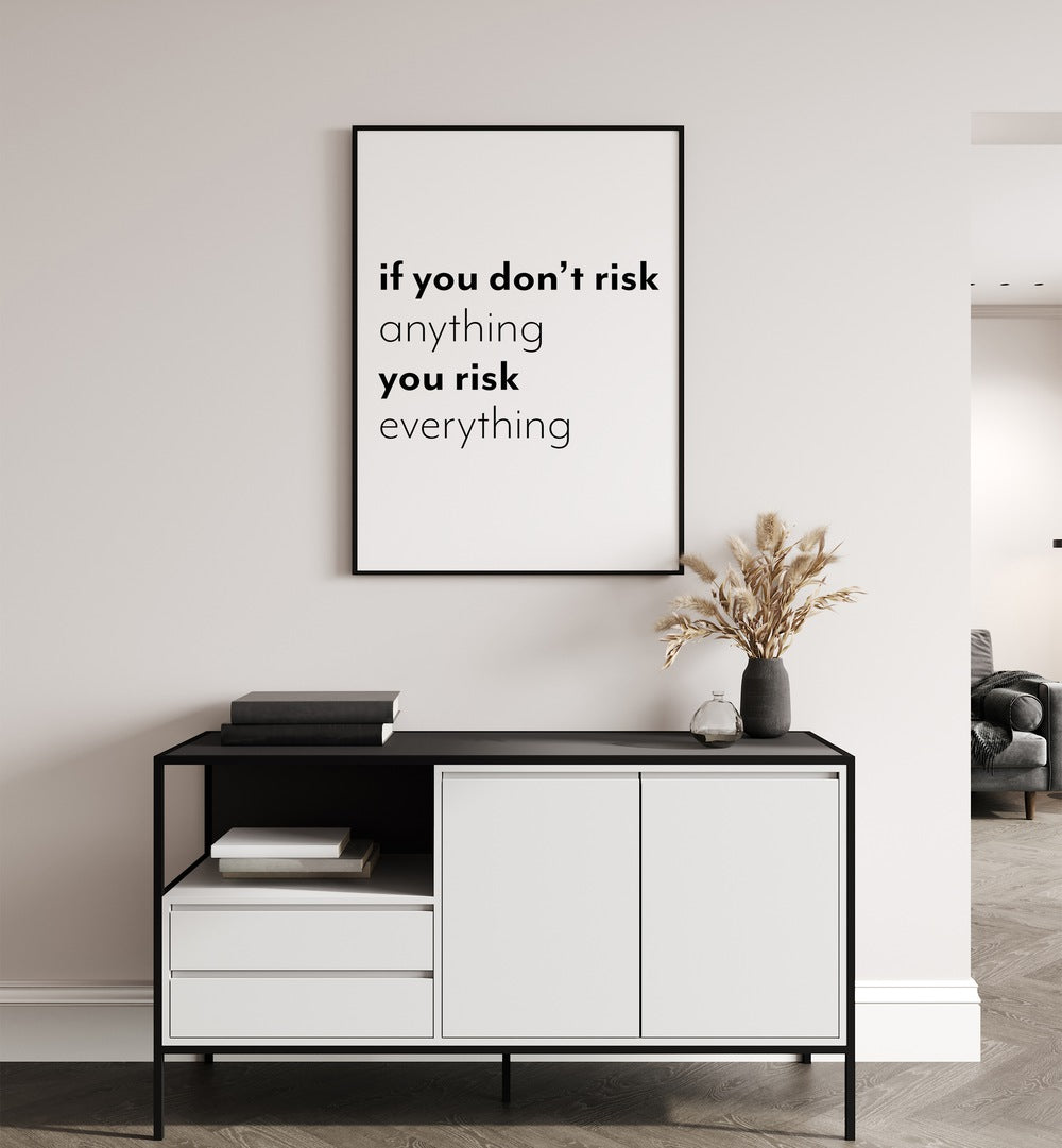 If You Dont Risk  By 1 X Studio Quotes And Typography Posters in Black Plain Frame placed on a White Colored Wall above a Console Table in the Drawing Room