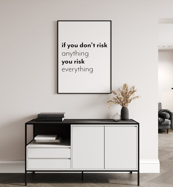 If You Dont Risk  By 1 X Studio Quotes And Typography Posters in Black Plain Frame placed on a White Colored Wall above a Console Table in the Drawing Room