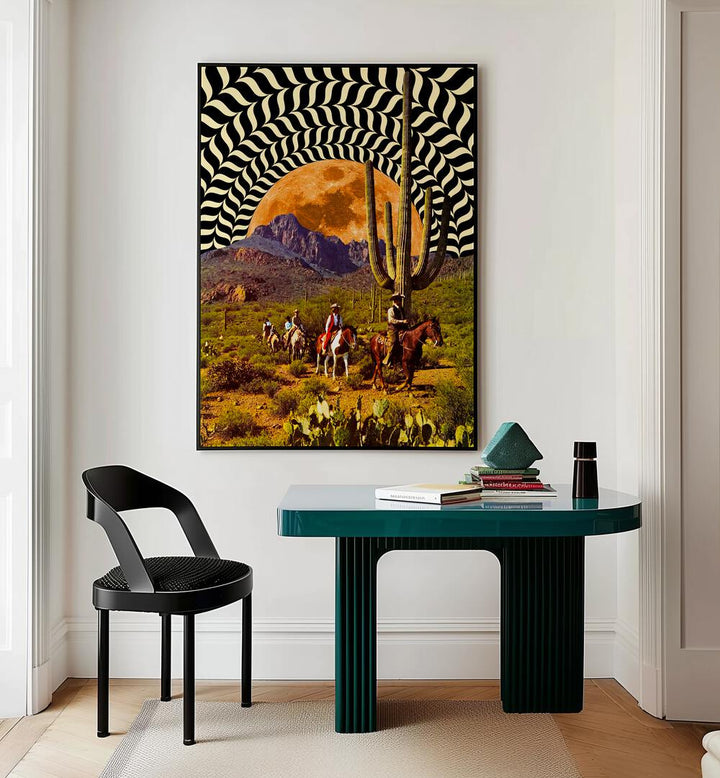 Illusionary Cowboys Surreal Paintings Surreal Art Prints in Black Plain Frame placed on a White Colored Wall Above a Study Table near a Workspace in the Drawing Room