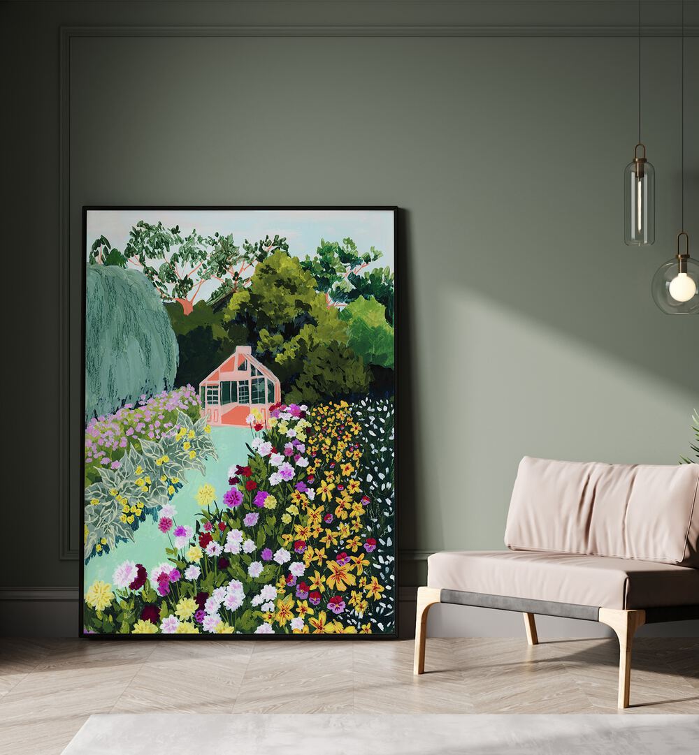 In Bloom By Sarah Gesek Wall Art Prints in Black Plain Frame placed on the floor beside a sofa