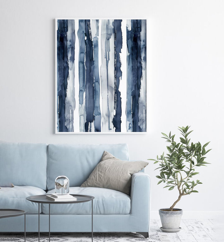 Indigo Waves Beach Prints Coastal Wall Art in White Plain Frame placed on a wall behind a sofa