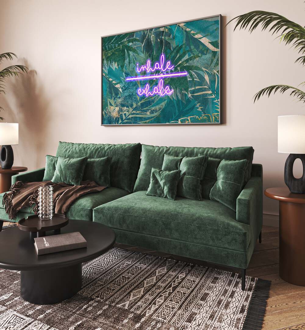 Inhale Exhale By Sarah Manovski Quotes and Typography Poster in Black Plain Frame on a wall behind a green sofa for living room