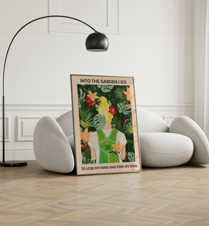 Into The Garden Blonde Portraits and Figurative Illustrations in Black Plain Frame placed on the floor beside a sofa and a lamp