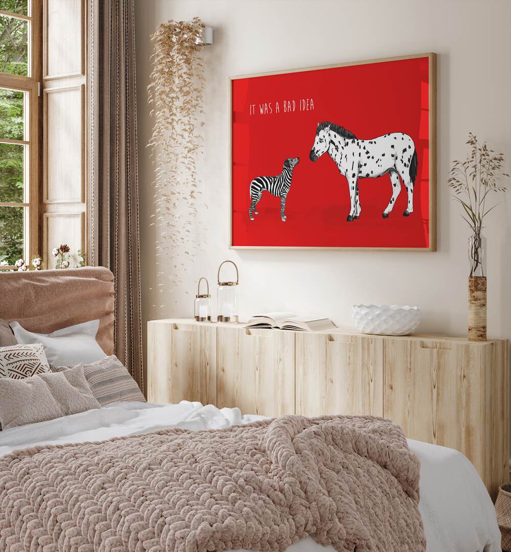 It Was A Bad Idea By Balazs Solti Kids Room Art in Oak Wood Plain Frame placed on a Cream Colored Wall above a Console Table near a Bed in the Bedroom