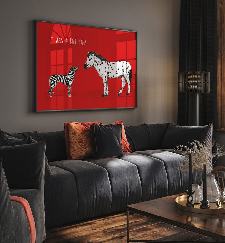 It Was A Bad Idea By Balazs Solti Kids Room Art in Black Plain Frame placed on a Dark Grey Colored Wall near a Dark Grey Sofa in the Living Room