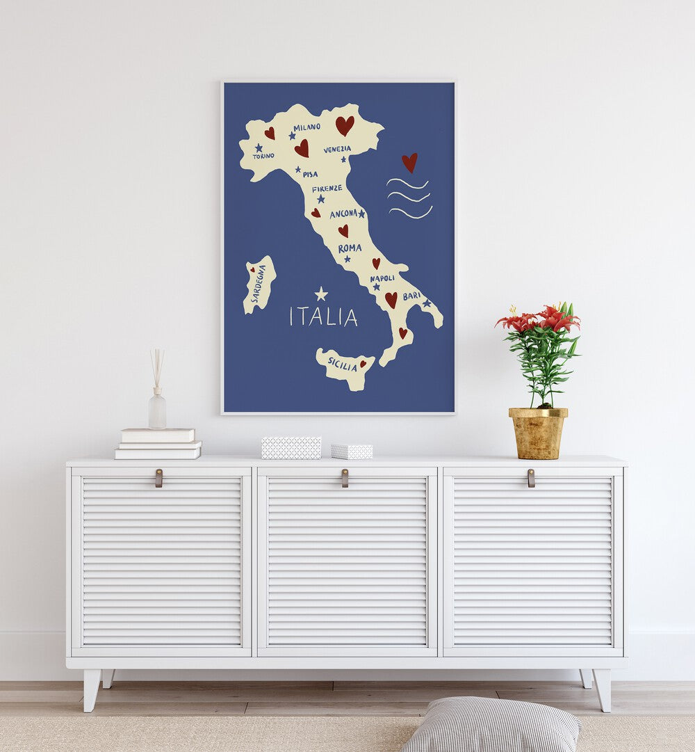 Italiya Map by Studio Dolci Travel Posters in White Plain Frame placed on a wall behind a console table