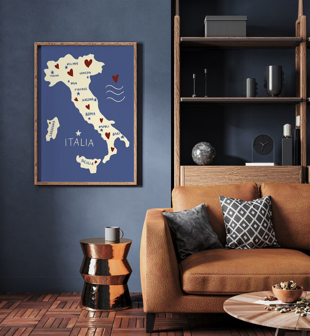 Italiya Map by Studio Dolci Travel Posters in Oak Wood Plain Frame on a wall beside a sofa