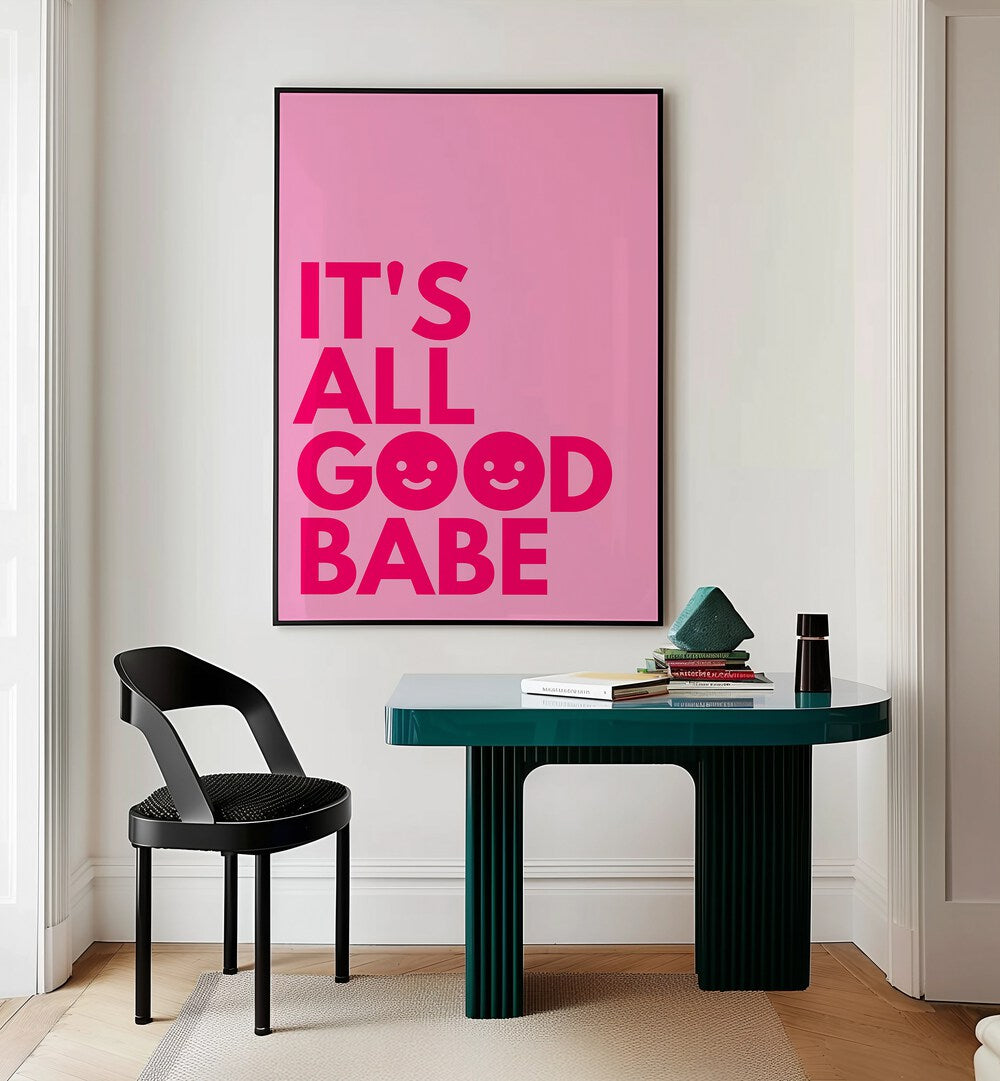 Its All Good Babe by Athene Fritsch Quotes and Typography Posters in Black Plain Frame placed on a wall behind a study table