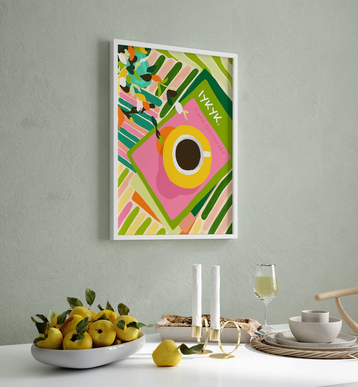 Iykyki By Uma Gokhale Bar and Cafe Art Prints in White Plain Frame on a wall behind a dining table