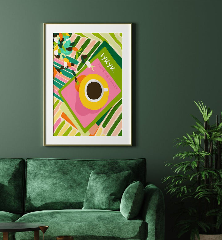 Iykyki By Uma Gokhale Bar and Cafe Art Prints in Gold Frame With Mount on a wall behind a green sofa