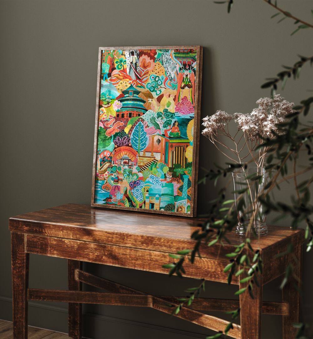 Journey Of Discovery Artwork Indian Art Painting Artwork in plain oakwood frame on brown table beside flower vase