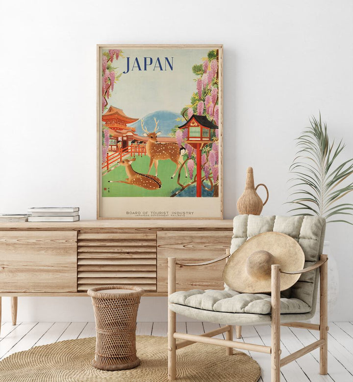 Japan Retro Art I  Vintage Travel Posters in Oak Wood Plain Frame placed on a console table behind a chair