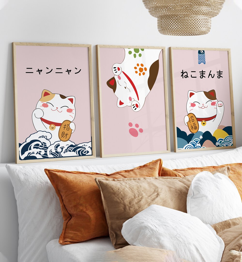 Japanese Kitty Set Set Of 3 Paintings in Oak Wood Plain Frame placed on a shelf behind a bed for bedroom