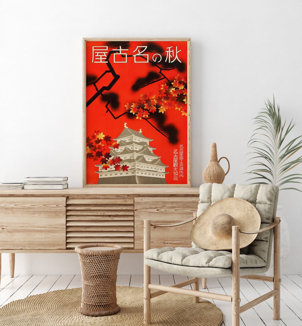 Japanese Temple  Vintage Travel Posters in Oak Wood Plain Frame placed on a console table behind a chair