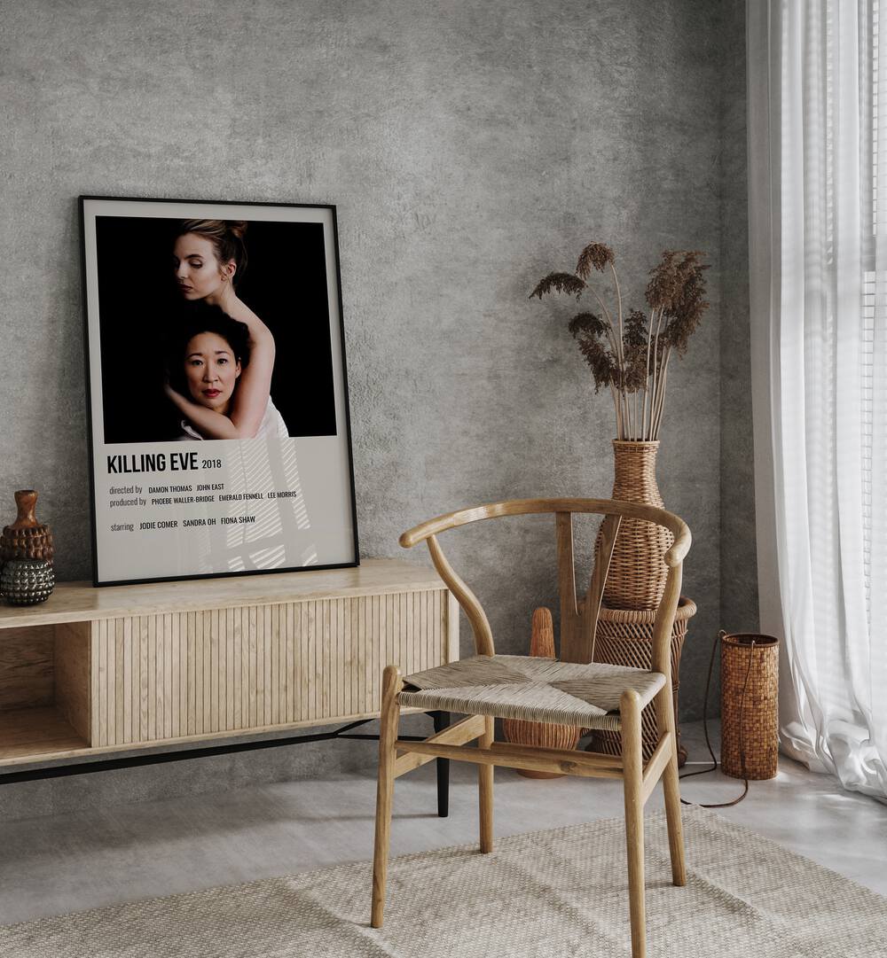 KILLING EVE 2018 MOVIE POSTERS in Black Plain Frame placed on a table beside chair