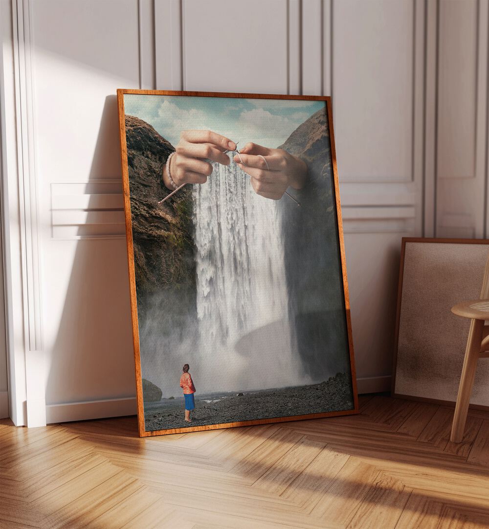 Knitted Waterfall Crochet Surreal Art Painting Artwork in plain oakwood frame on a wooden floor beside an artwork