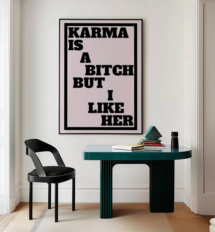 Karma is a Bitch by Athene Fritsch Quotes and Typography Posters in Black Plain Frame placed on a wall behind a study table