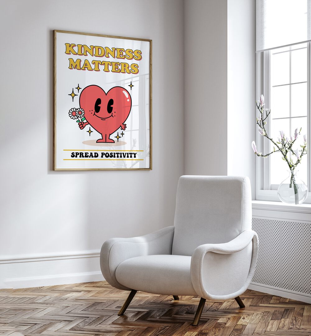 Kindness Matters Quotes and Typography Posters in Oak Wood Plain Frame placed on a wall beside a chair and window