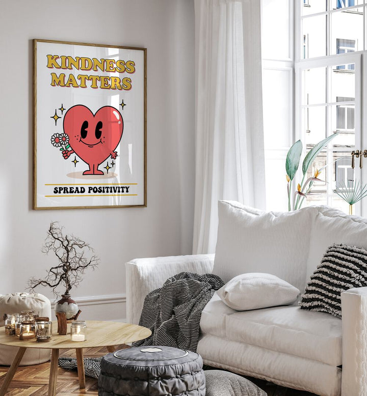 Kindness Matters Quotes and Typography Posters in Oak Wood Plain Frame placed on a wall beside a sofa and window