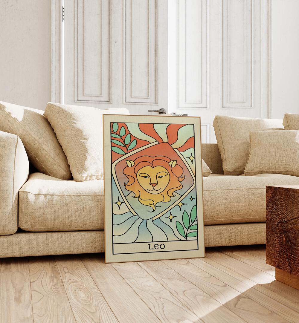 Leo Zodiac & Tarot Art Painting Artwork in plain oakwood frame beside a sofa