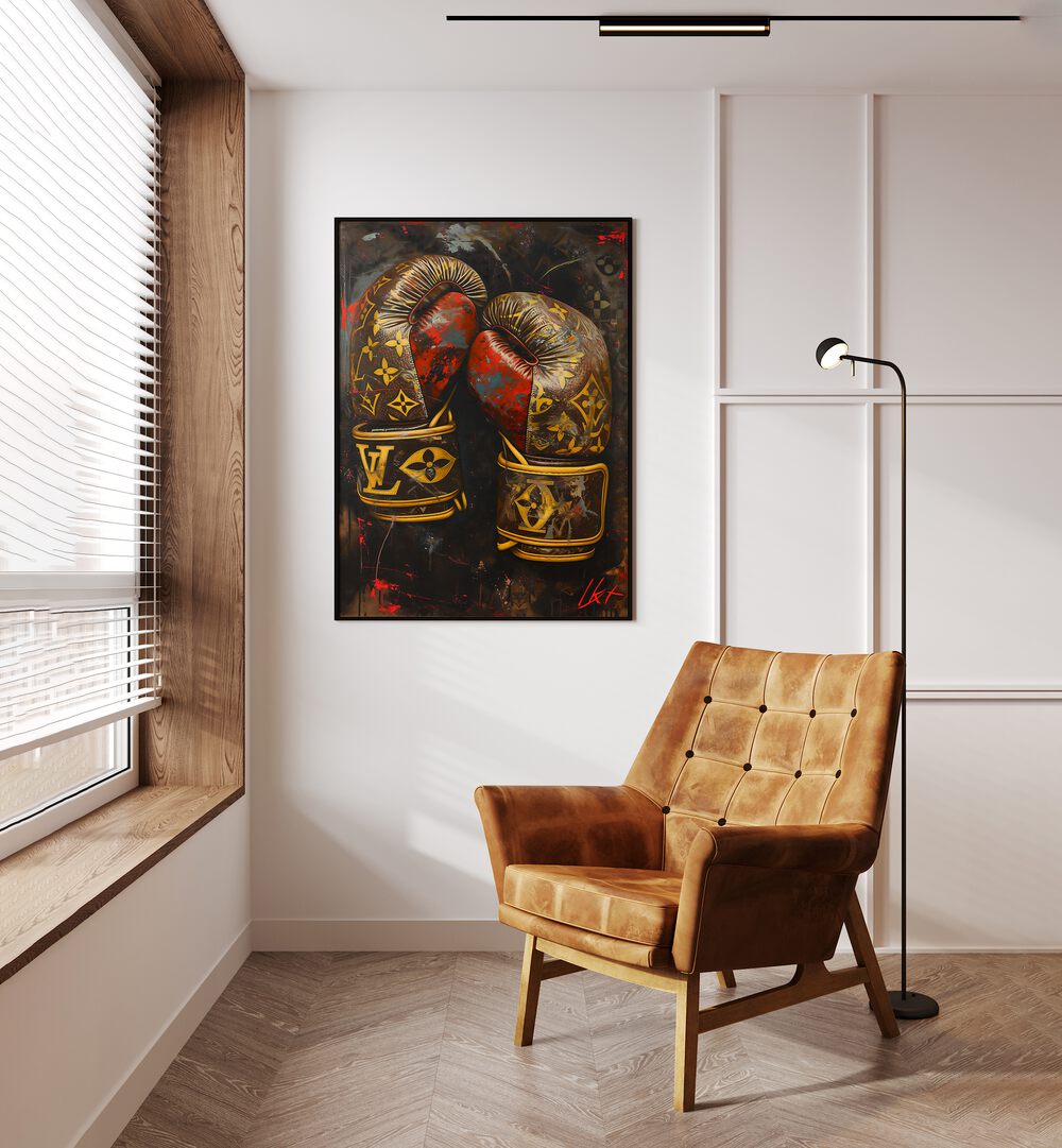 LV Boxing Gloves Gaming Posters in Black Plain Frame placed on a Cream Colored Wall near a Brown Sofa Chair in the Drawing Room