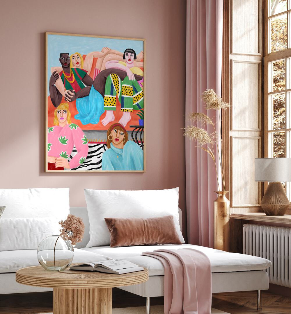 La Coloc By Cepe Wallart Prints in Oak Wood Plain Frame on a pink wall placed behind a white sofa