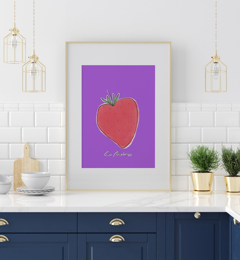 La Fraise by Uplus Me Studio Kitchen Art Prints Kitchen Posters in White Frame With Mount placed on a kitchen counter for kitchen area