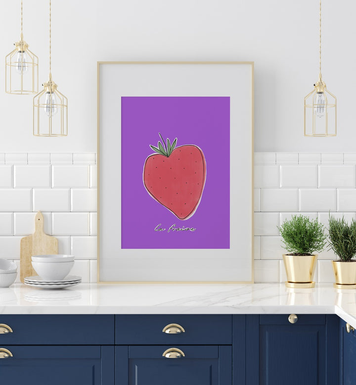 La Fraise by Uplus Me Studio Kitchen Art Prints Kitchen Posters in White Frame With Mount placed on a kitchen counter for kitchen area