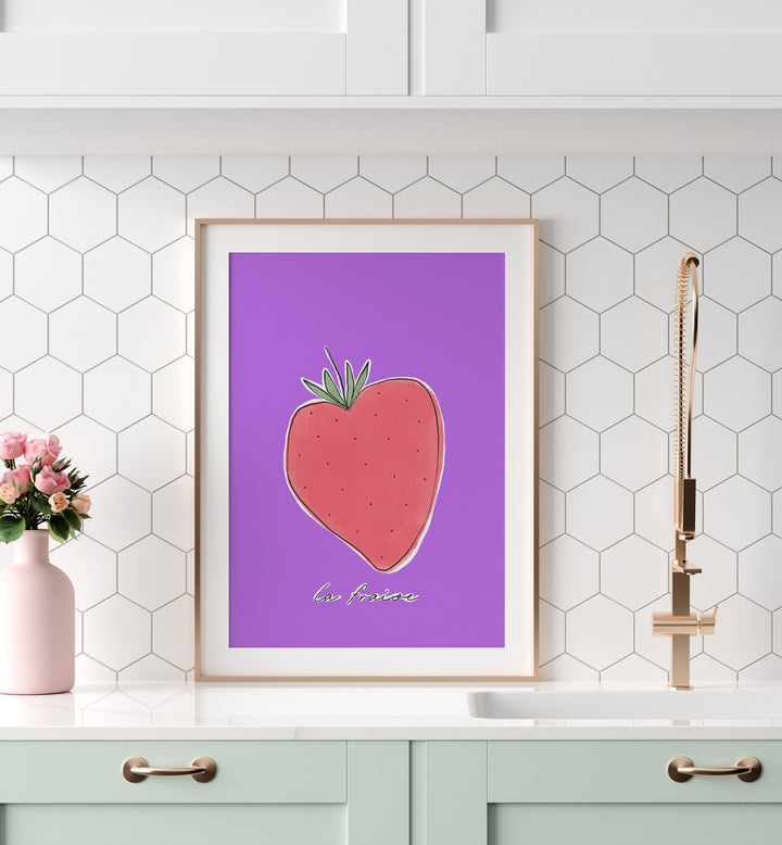 La Fraise by Uplus Me Studio Kitchen Art Prints Kitchen Posters in White Frame With Mount placed on a kitchen counter for kitchen area