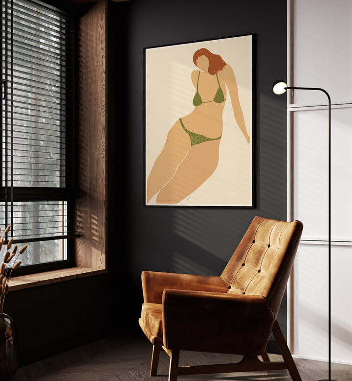 Lady Seashore By Andi Bell Beach Prints in Black Plain Frame on a grey wall placed beside an orange sofa