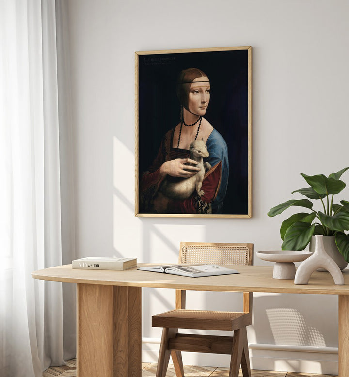 Lady With An Emrin Vintage Paintings in Oak Wood Plain Frame placed on a white wall behind a study table