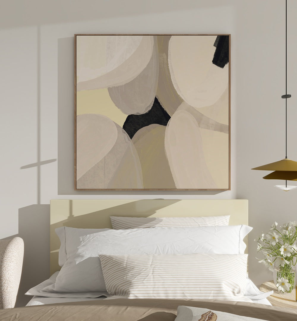 Laetitia by Yopie Studio Abstract Paintings Abstract Art Prints in Oak Wood Floater Frame placed on a wall in a bedroom behind a bed